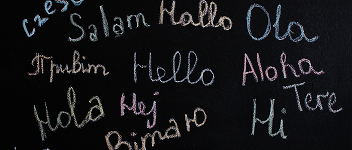 Hello written in multiple languages on blackboard